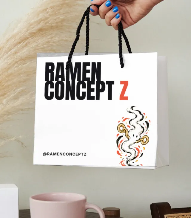 White shopping bag printed with the Ramen Concept Z wordmark and steam character