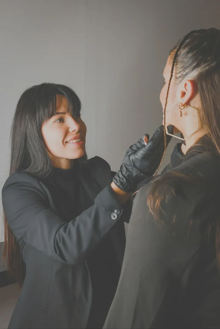 A stylist finishing a client’s look