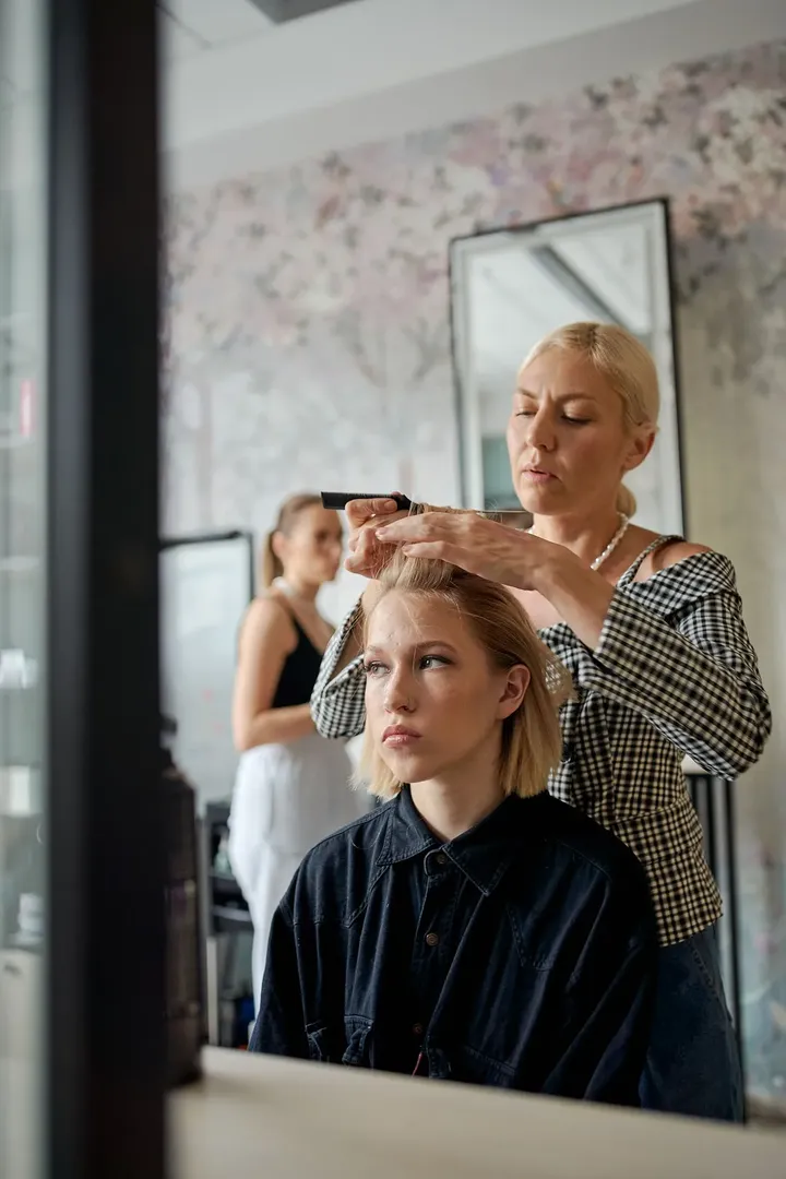 A stylist working at a bright salon