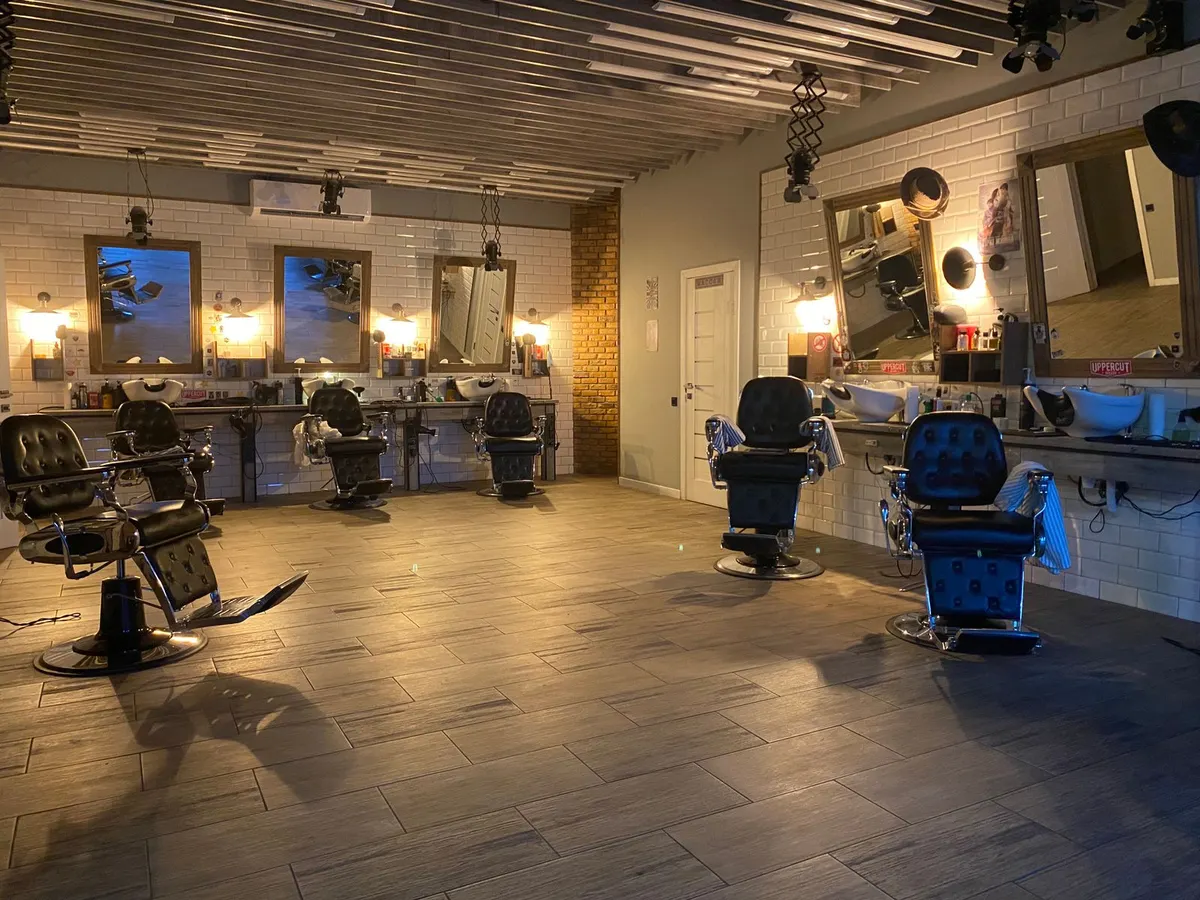 Empty barbershop with chairs ready