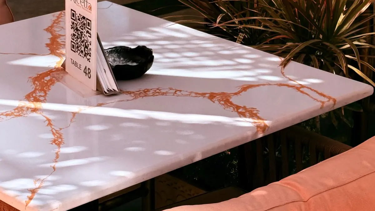 A QR code stand on a restaurant table