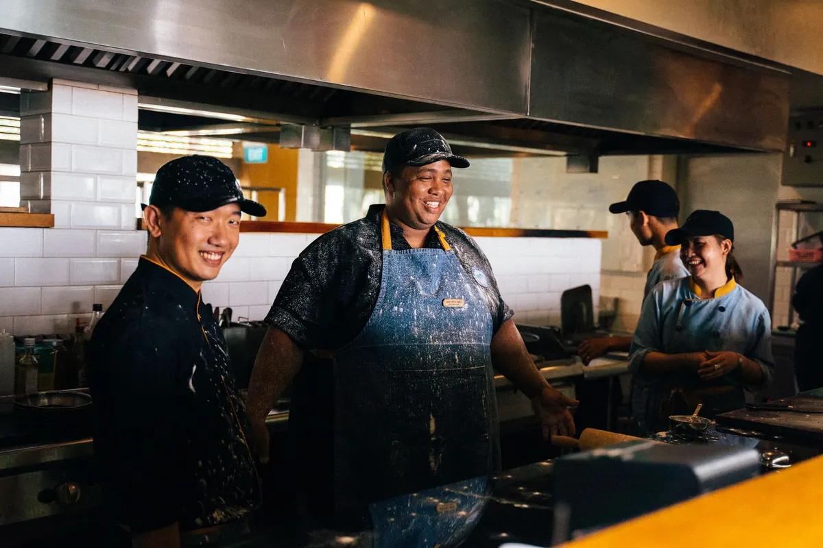 A smiling kitchen team