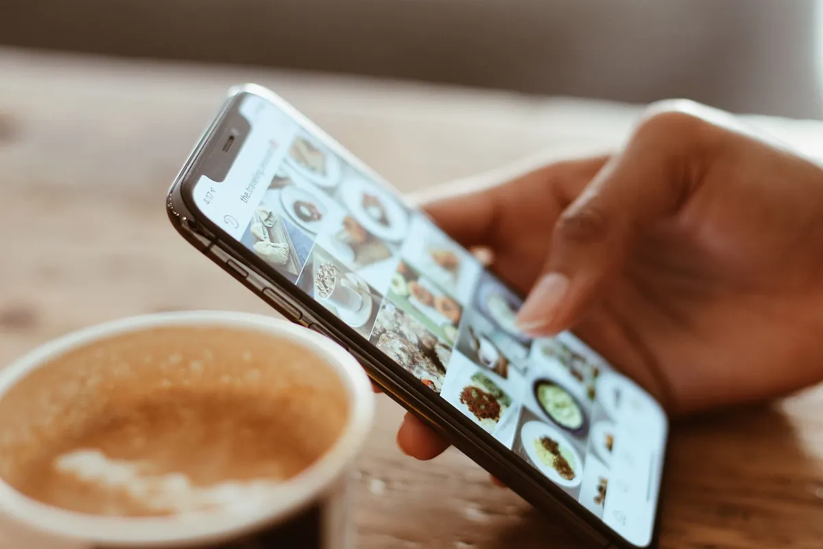 Scrolling food photos on a phone